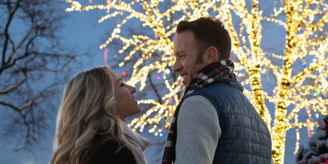 Couple in front of Tree of Light.